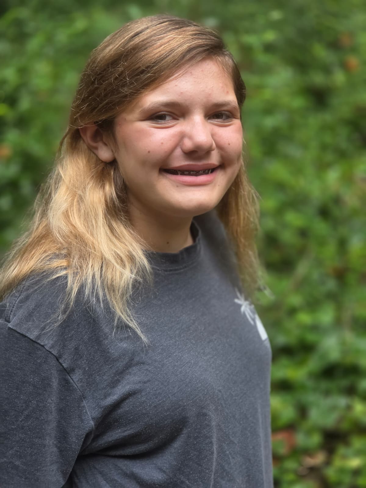 Ivy, smiling outdoors